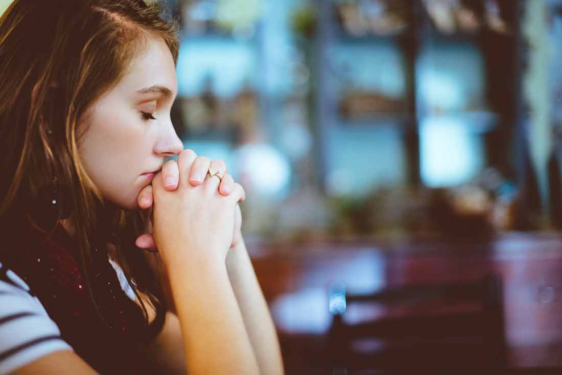 You are feeding your self-limiting beliefs with every choice you make. Image of regretful looking girl