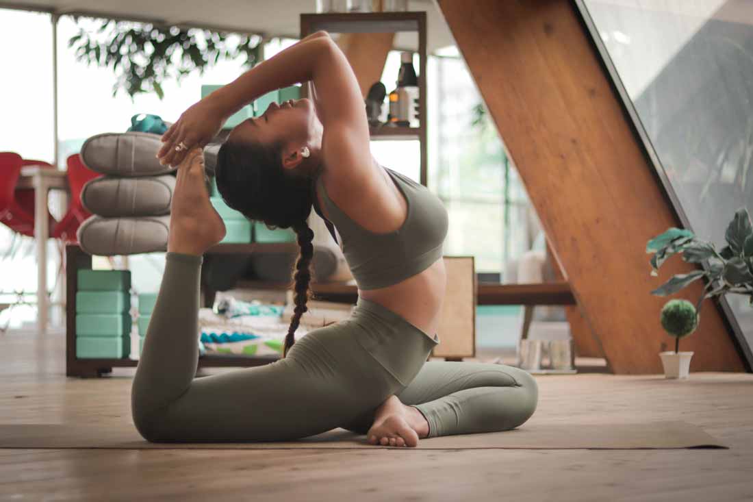 What is prana? Yoga is one of the principle ways to raise the prana in the system. Image of a woman in a yoga asana.